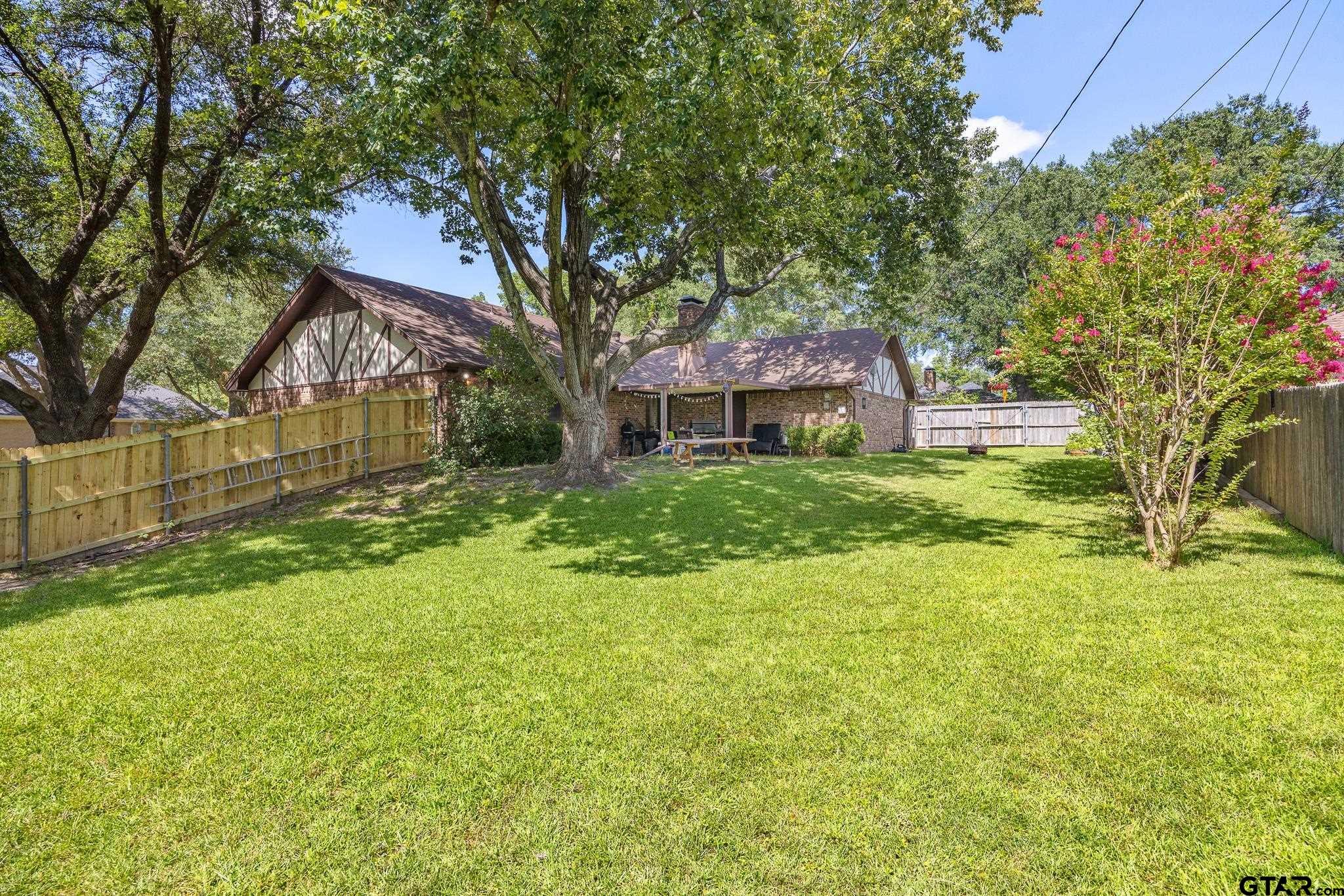 802 Carriage Drive Tyler, TX 75703 - Photo 17 of 21 a front view of house with yard and green space