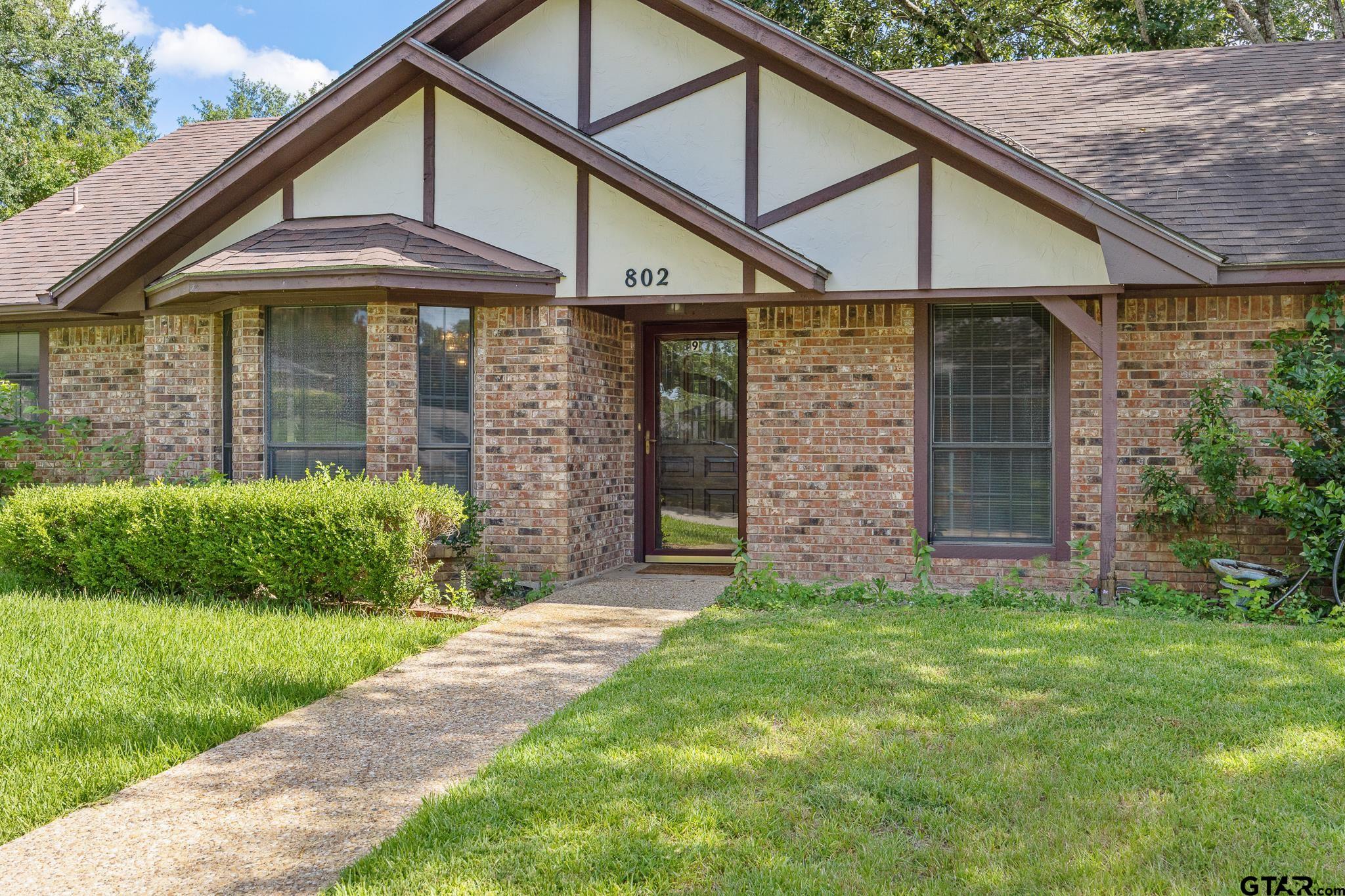 802 Carriage Drive Tyler, TX 75703 - Photo 4 of 21 a front view of a house with garden