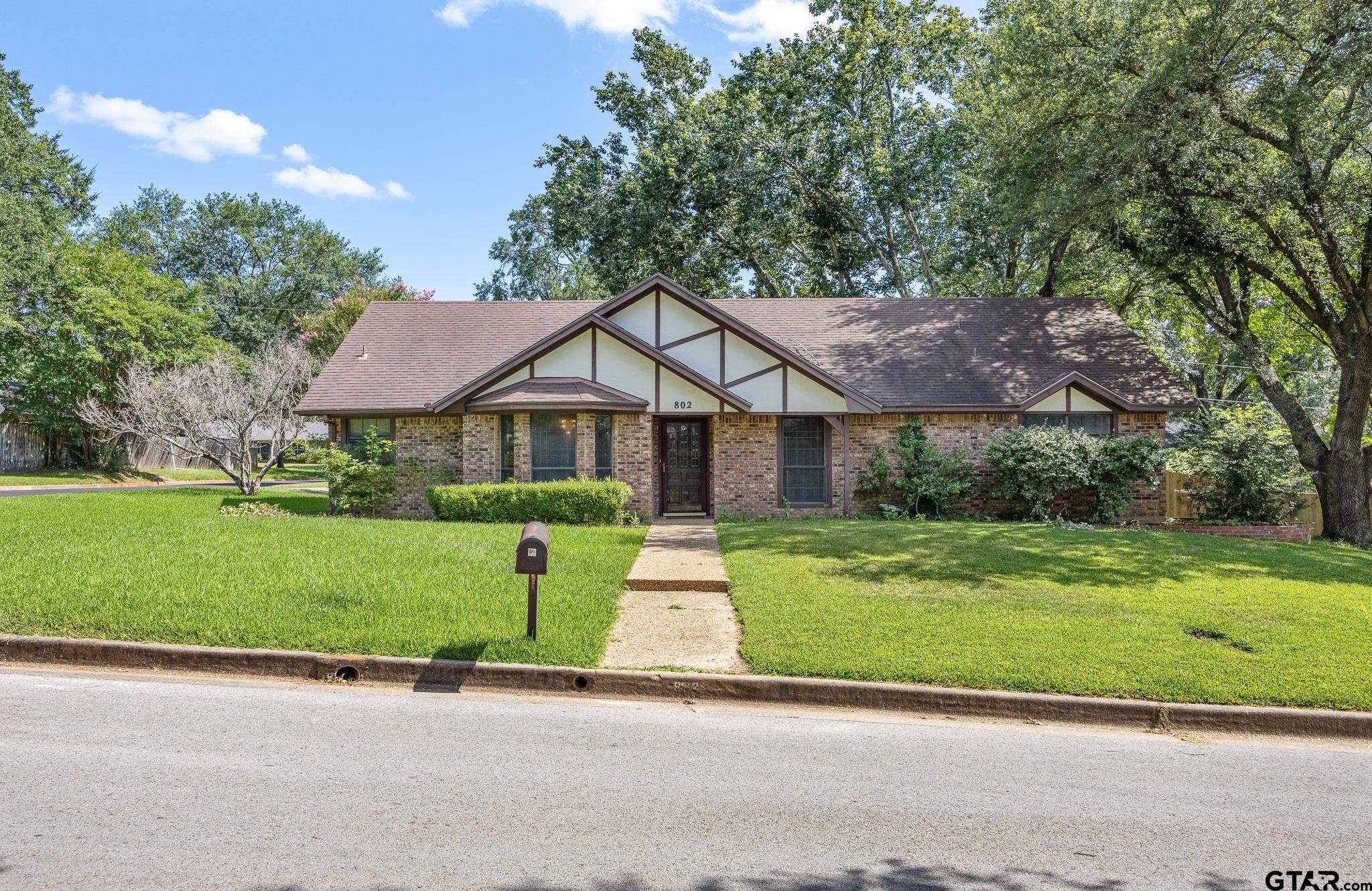 802 Carriage Drive Tyler, TX 75703 - Photo 5 of 21 a front view of house with yard and green space