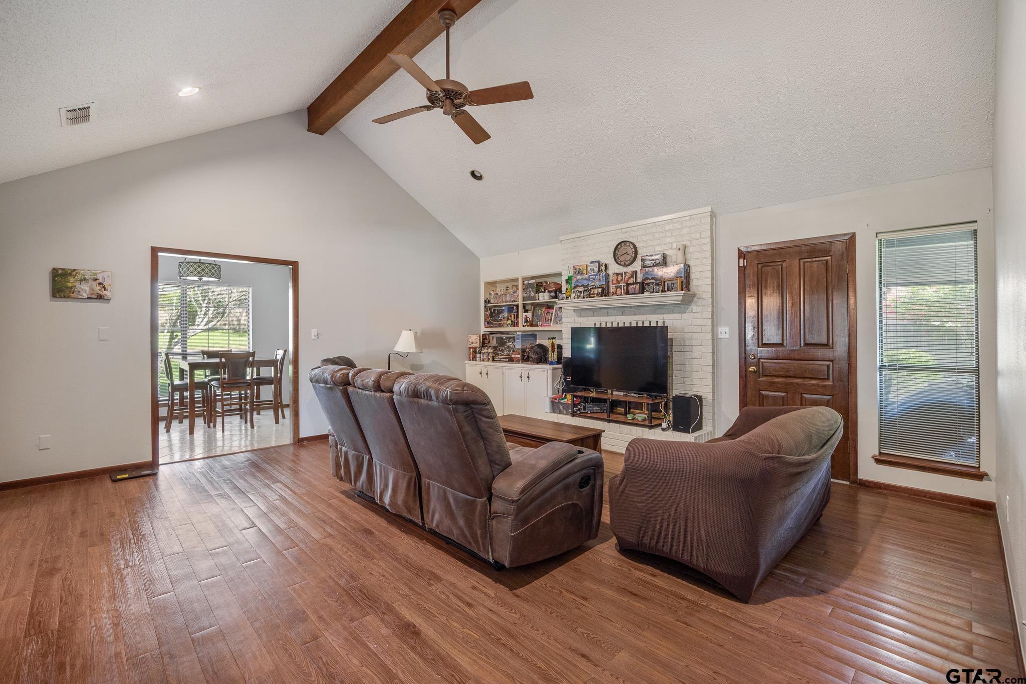 802 Carriage Drive Tyler, TX 75703 - Photo 9 of 21 a living room with furniture and a fireplace