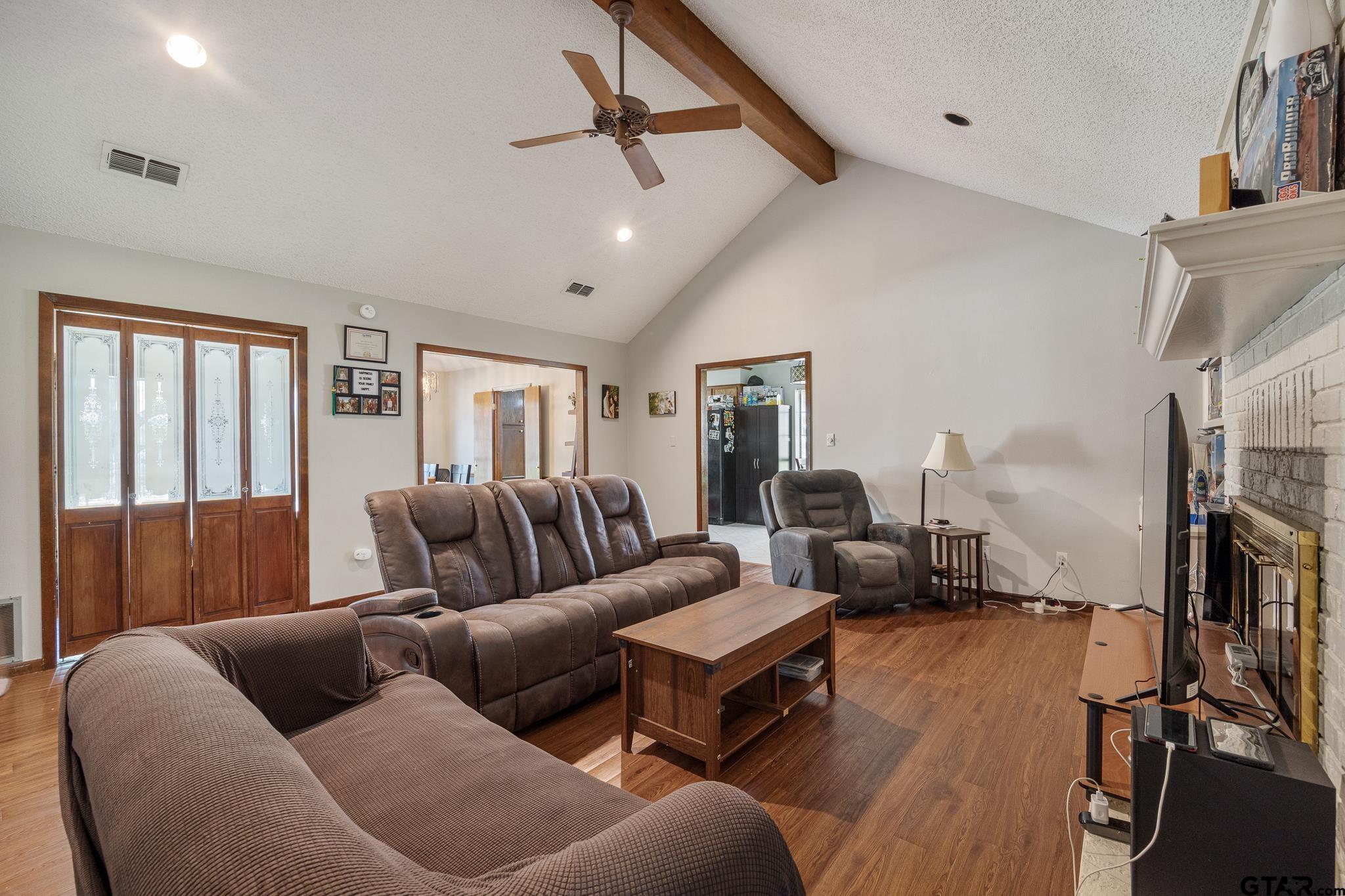 802 Carriage Drive Tyler, TX 75703 - Photo 10 of 21 a living room with furniture and a flat screen tv