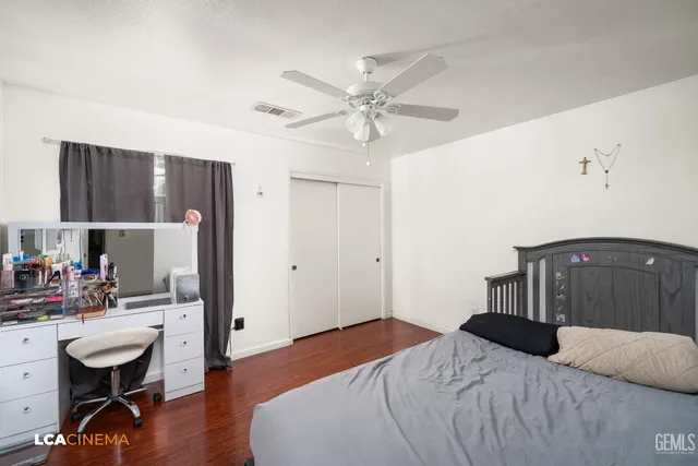 a bedroom that has a bed and a table in it