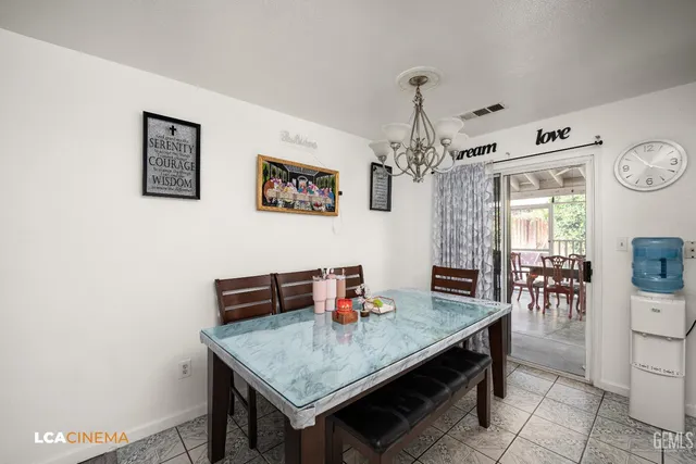 a dining room with a table and chairs