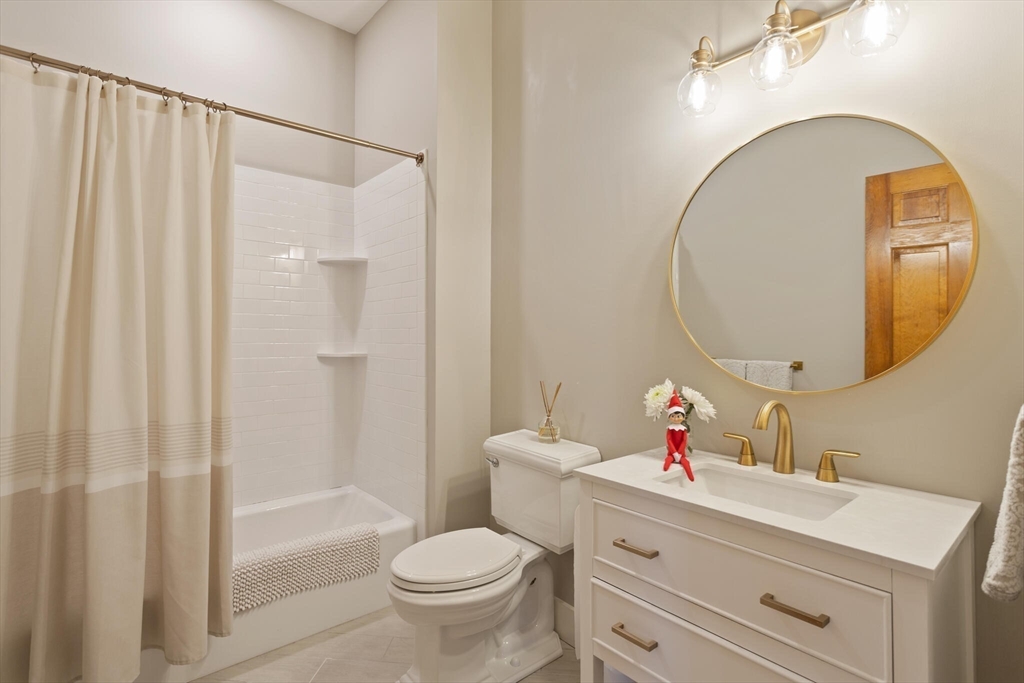 22 Sanderson Road Littleton, MA 01460 - Photo 17 of 30 a bathroom with a sink mirror and toilet