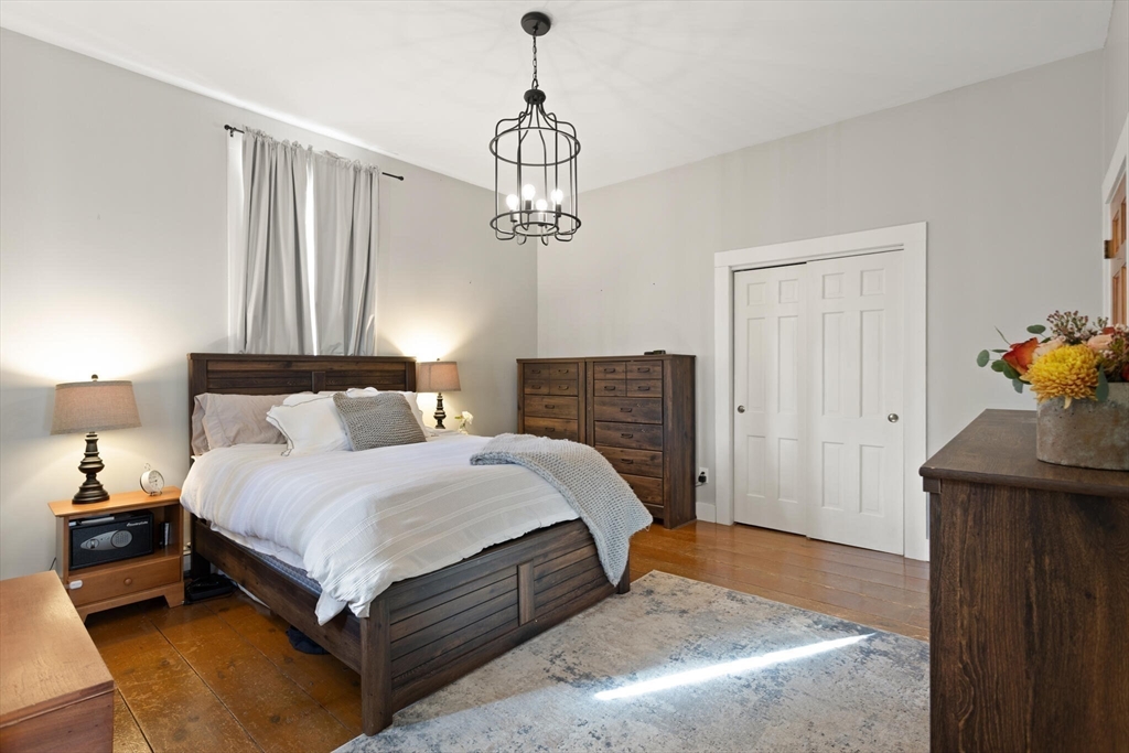 22 Sanderson Road Littleton, MA 01460 - Photo 18 of 30 a bedroom with a bed and window