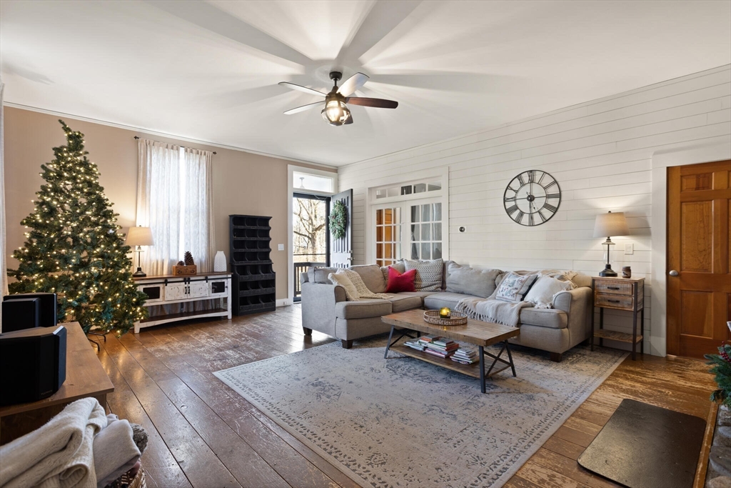 22 Sanderson Road Littleton, MA 01460 - Photo 2 of 30 a living room with furniture and a fireplace