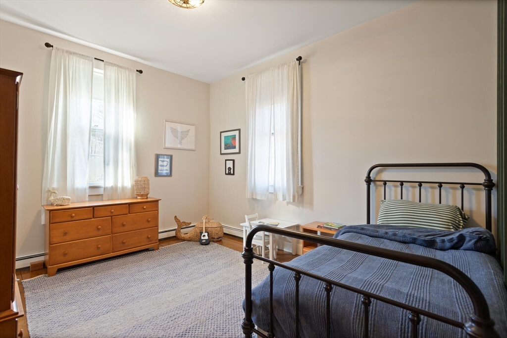 22 Sanderson Road Littleton, MA 01460 - Photo 22 of 30 a bedroom with a bed and a window