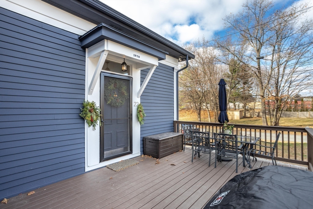 22 Sanderson Road Littleton, MA 01460 - Photo 26 of 30 a porch with seating space and hardwood floor
