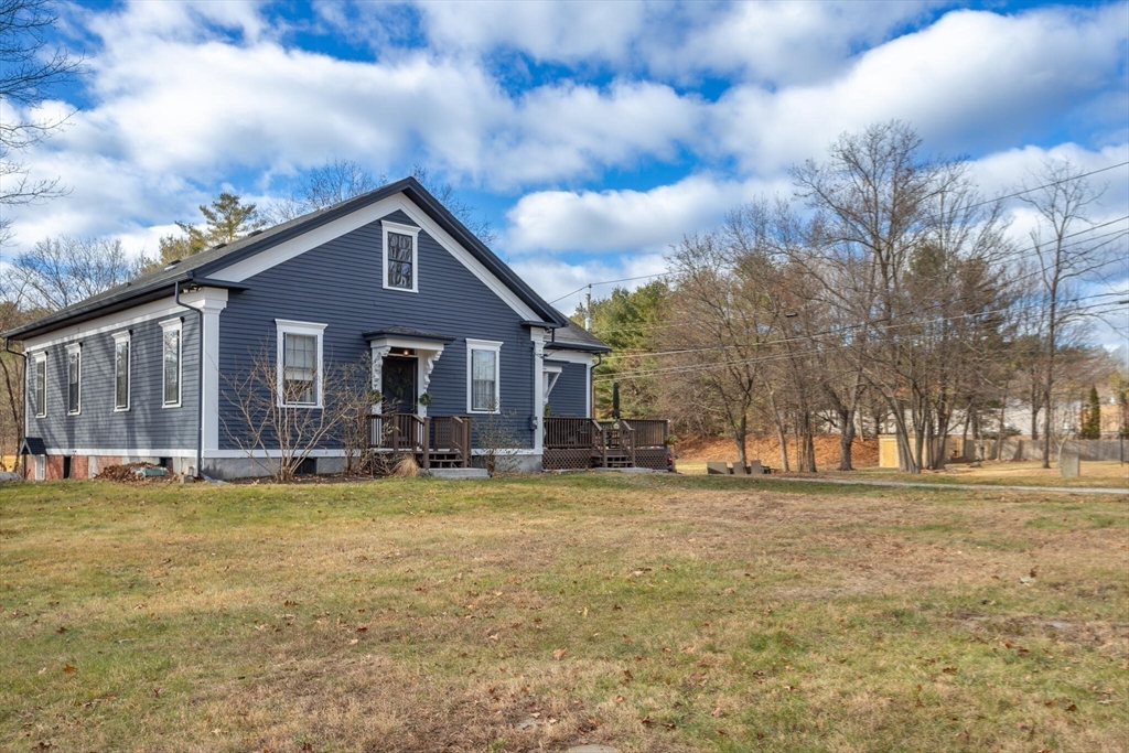 22 Sanderson Road Littleton, MA 01460 - Photo 28 of 30 a view of a house with a big yard and large trees