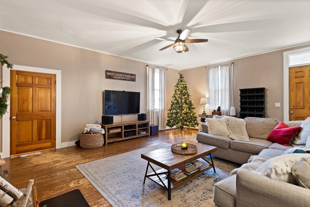22 Sanderson Road Littleton, MA 01460 - Photo 7 of 30 a living room with furniture and a flat screen tv