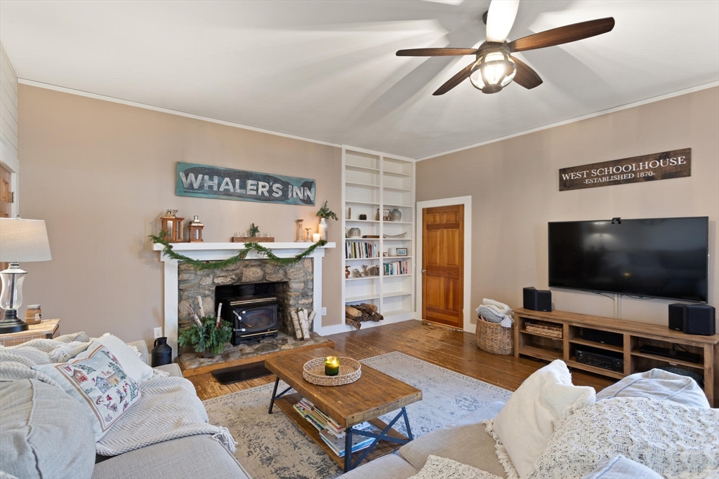22 Sanderson Road Littleton, MA 01460 - Photo 8 of 30 a living room with furniture and a flat screen tv