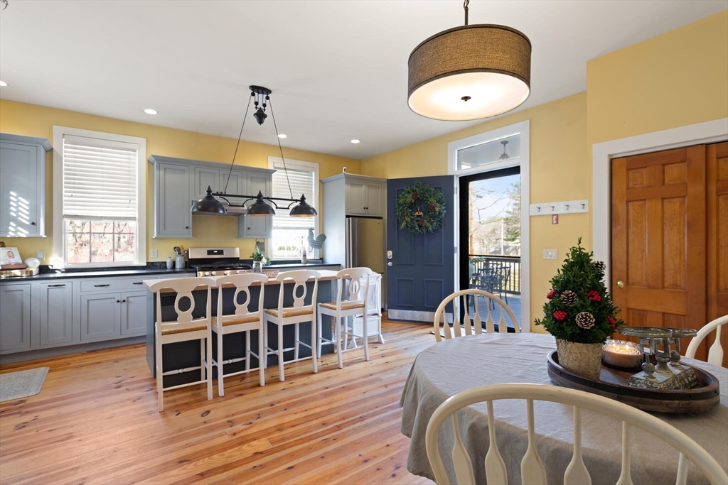 22 Sanderson Road Littleton, MA 01460 - Photo 10 of 30 a dining room with furniture and wooden floor