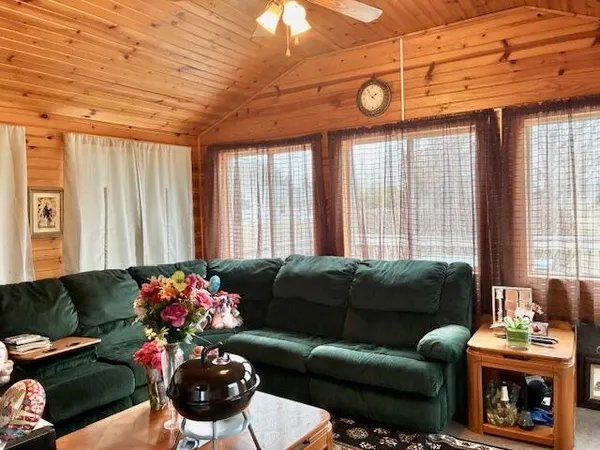 a large kitchen with stainless steel appliances and a sink