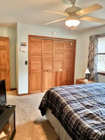 a room with gym equipment and mirror