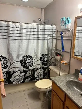 a living room with furniture fireplace and flat screen tv