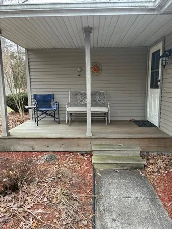 a front view of house with yard and trees