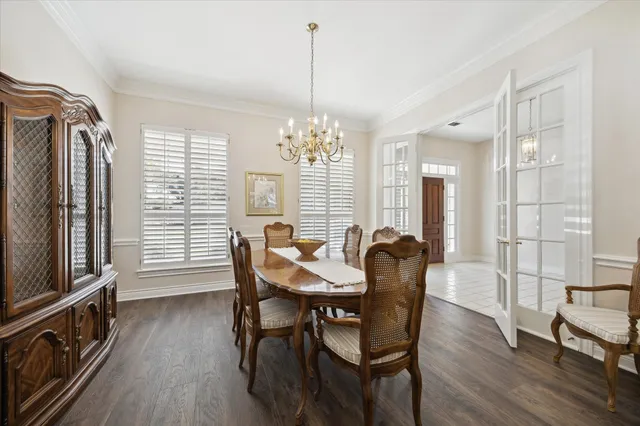 a dining room with furniture window wooden floor