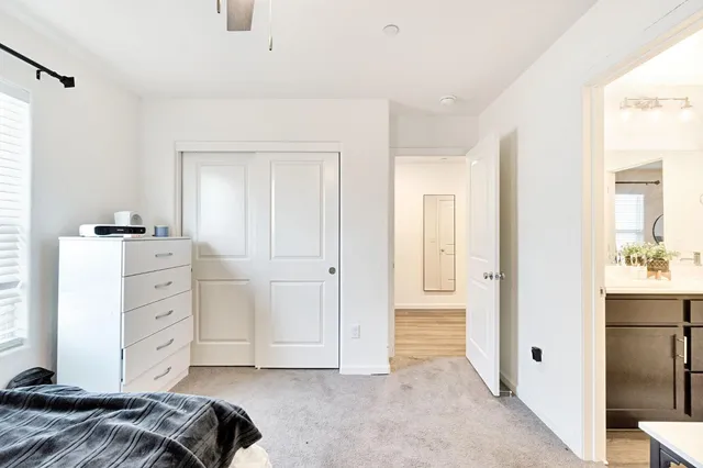 a bedroom with a bed and a cabinets