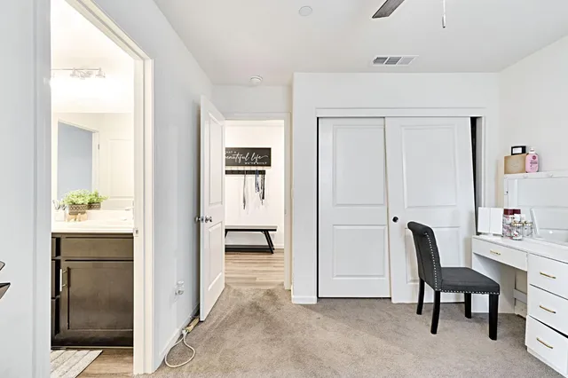 a view of kitchen with furniture and refrigerator