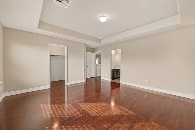 wooden floor with white walls