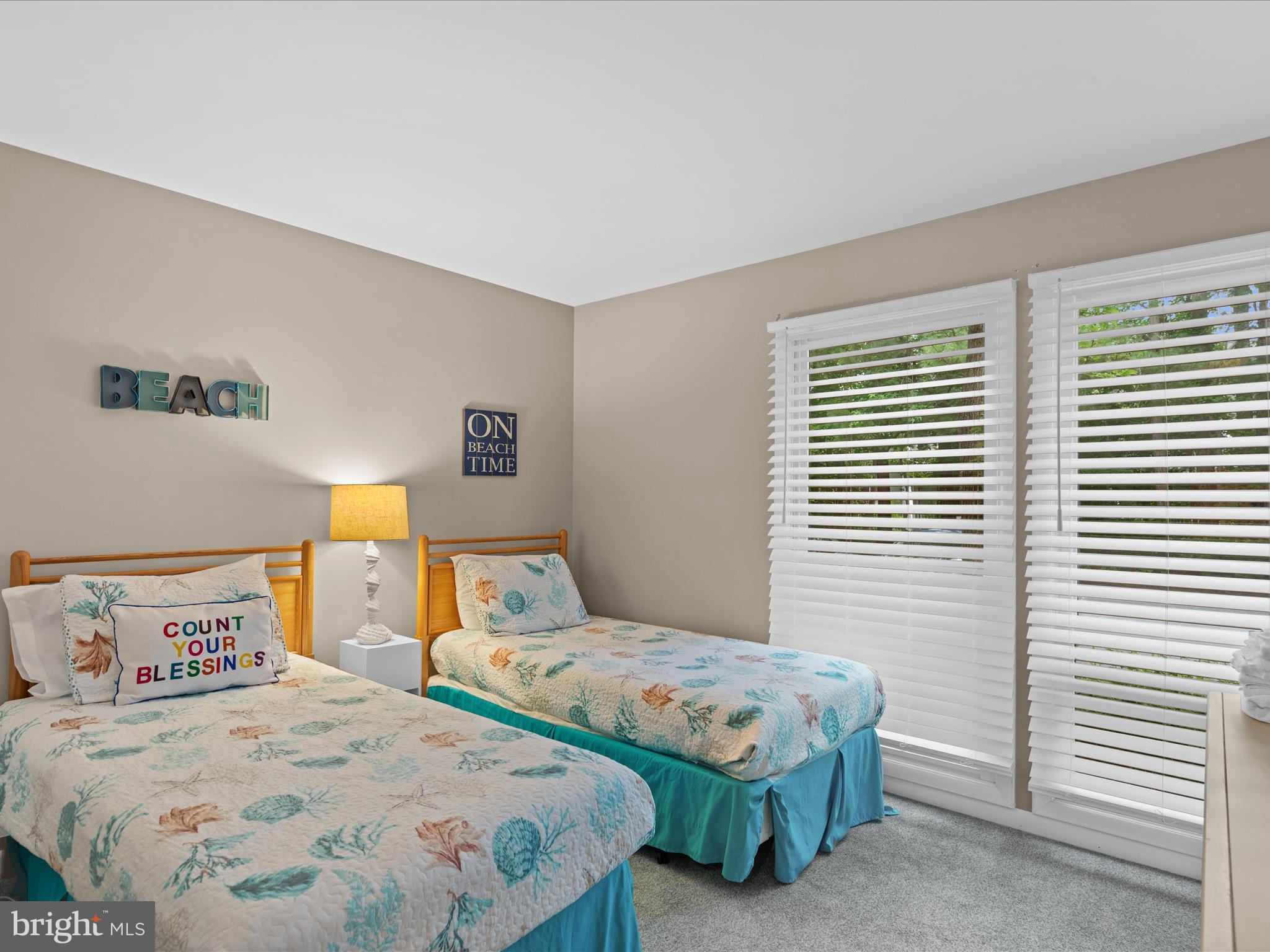 39346 Racquet Lane, Unit 8504 Bethany Beach, DE 19930 - Photo 20 of 40 a bedroom with a bed and a window