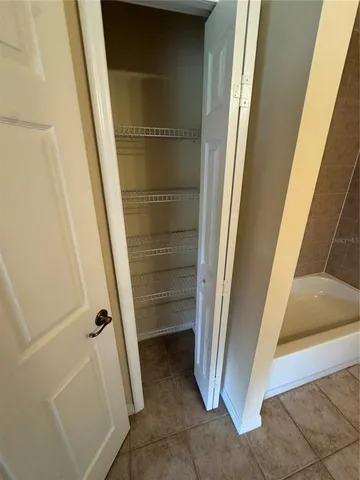 a bathroom with a tub and shower