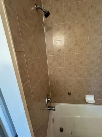 a bathroom with a sink toilet and a mirror