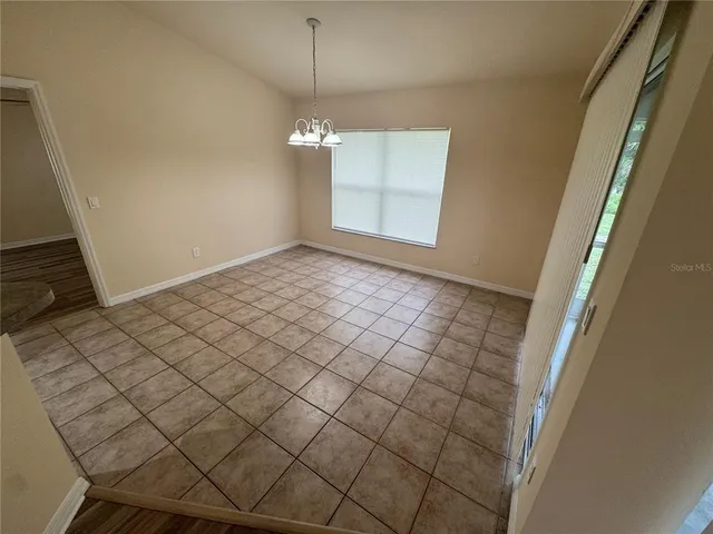 a view of an empty room and window
