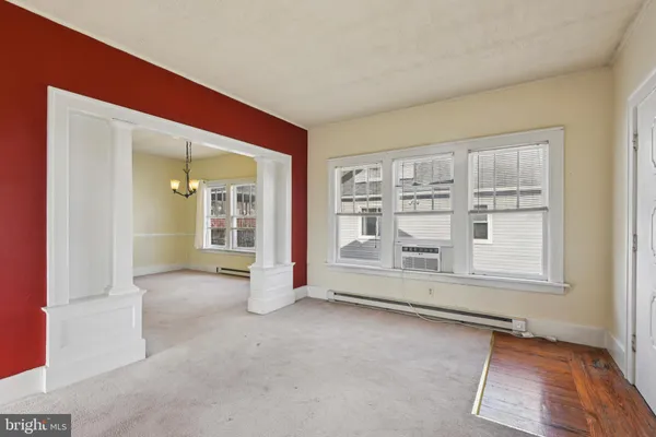 an empty room with a empty space and window