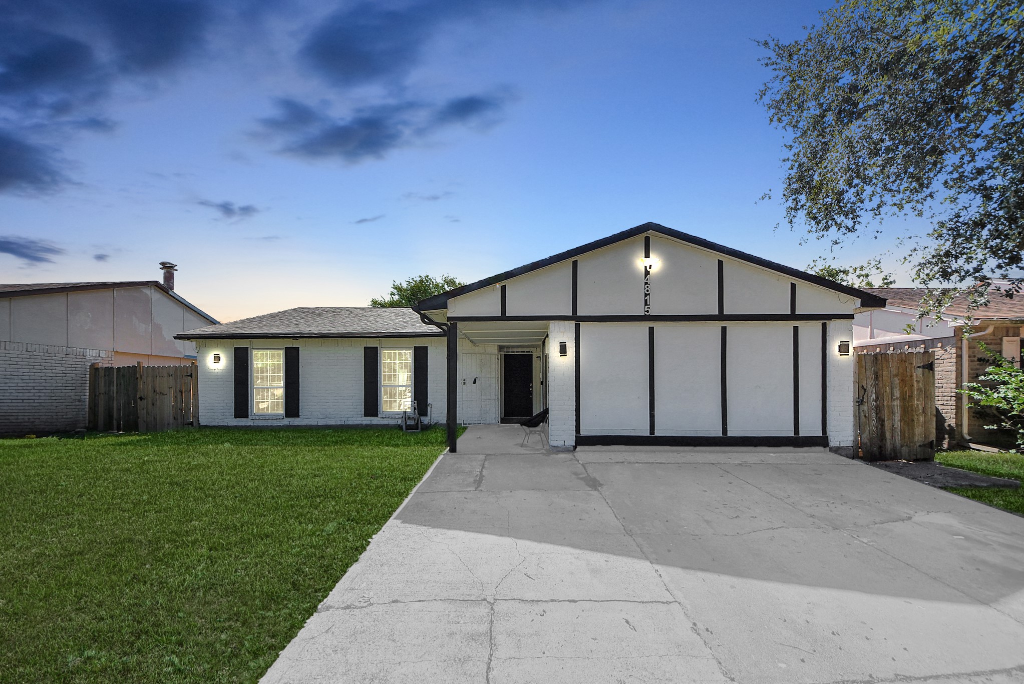 a view of a house with a yard and garage