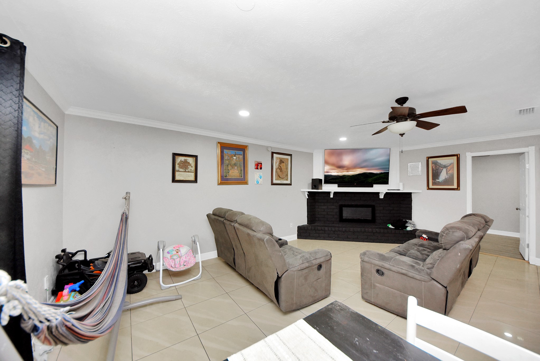 4815 Prairie Ridge Road Houston, TX 77053 - Photo 13 of 44 a living room with furniture and a wooden floor