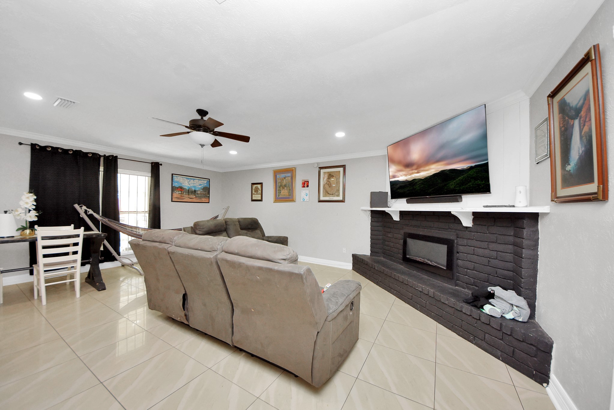 4815 Prairie Ridge Road Houston, TX 77053 - Photo 14 of 44 a living room with furniture and a flat screen tv