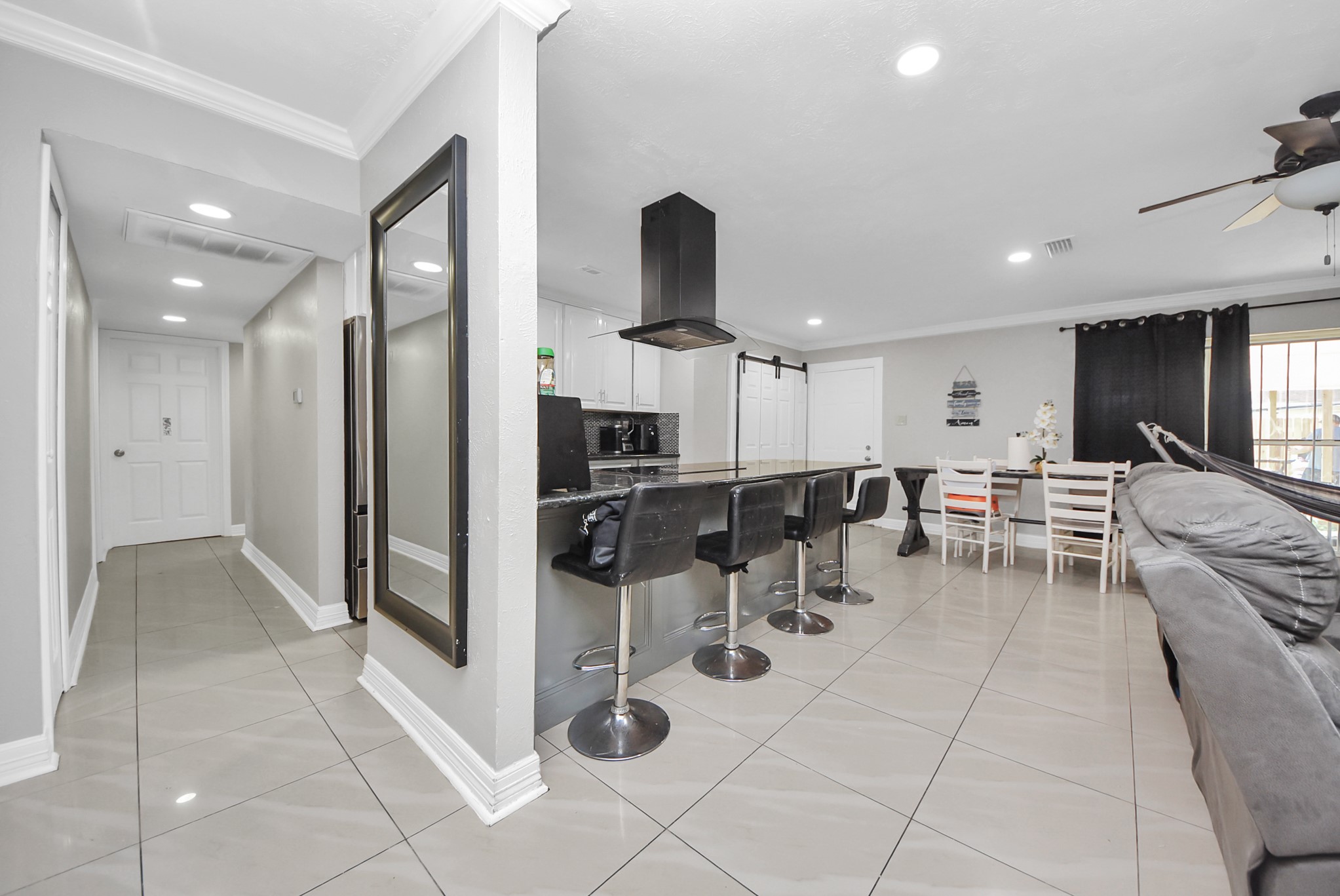 4815 Prairie Ridge Road Houston, TX 77053 - Photo 15 of 44 a living room with lots of chairs and mirrors
