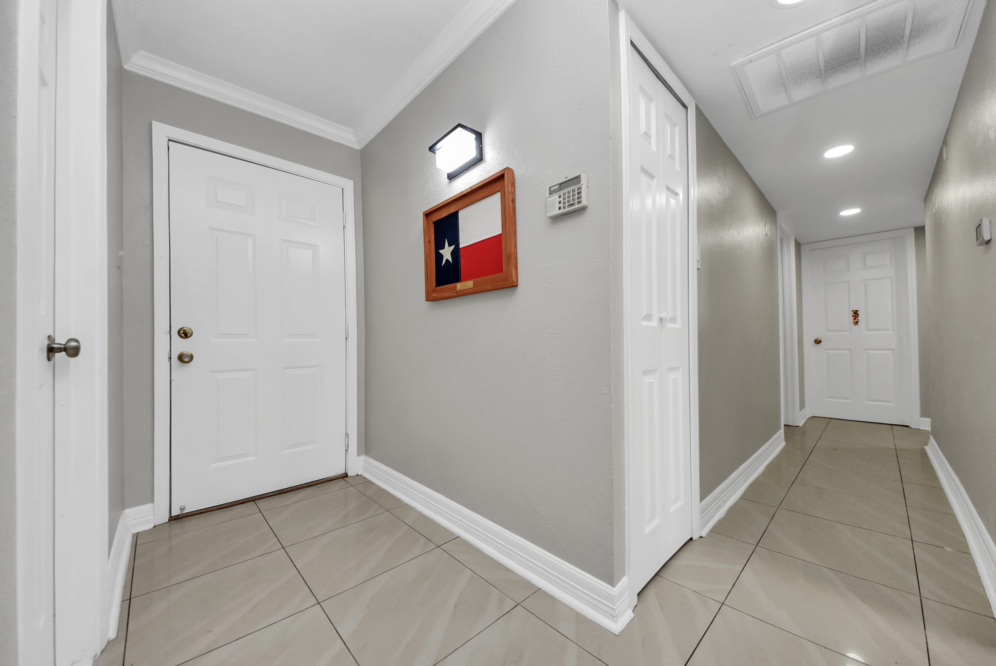 4815 Prairie Ridge Road Houston, TX 77053 - Photo 18 of 44 a view of a hallway with wooden shelves