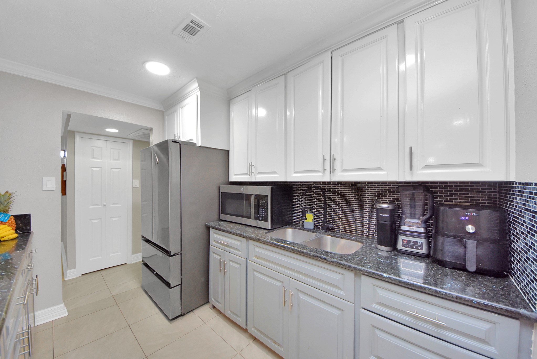 4815 Prairie Ridge Road Houston, TX 77053 - Photo 2 of 44 a kitchen with stainless steel appliances granite countertop a refrigerator and cabinets
