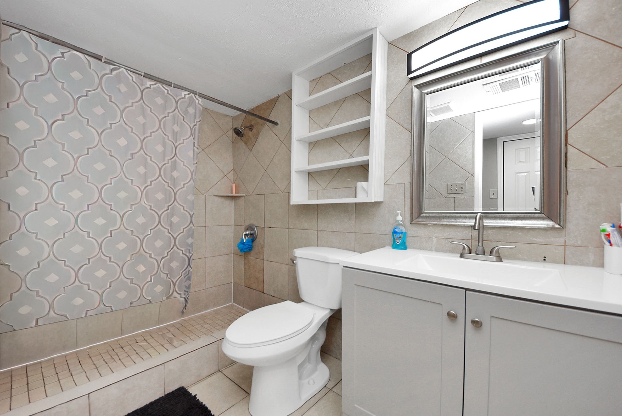 4815 Prairie Ridge Road Houston, TX 77053 - Photo 24 of 44 a bathroom with a sink a toilet and shower