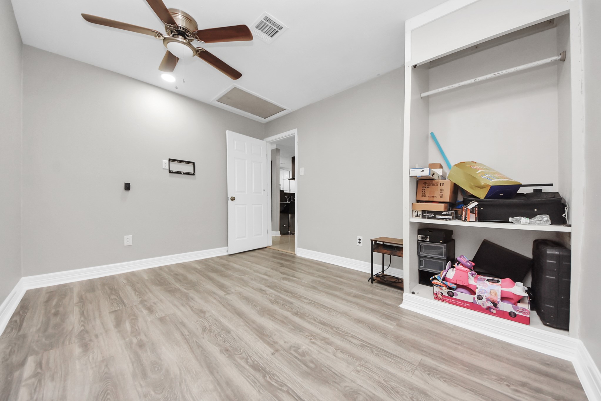 4815 Prairie Ridge Road Houston, TX 77053 - Photo 27 of 44 a view of a room with wooden floor and closet