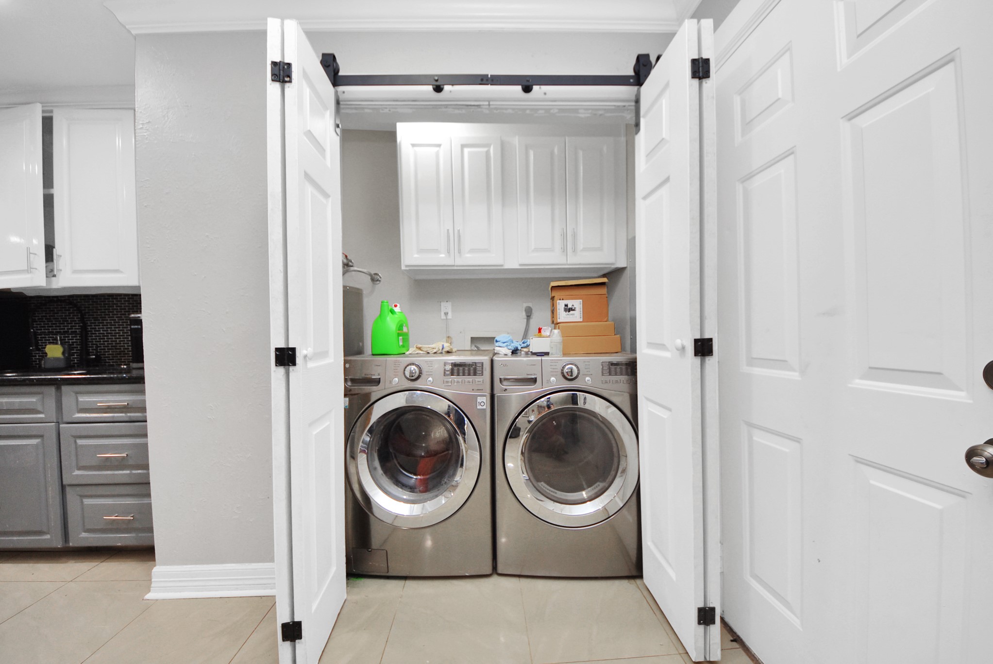4815 Prairie Ridge Road Houston, TX 77053 - Photo 29 of 44 a utility room with cabinets washer and dryer