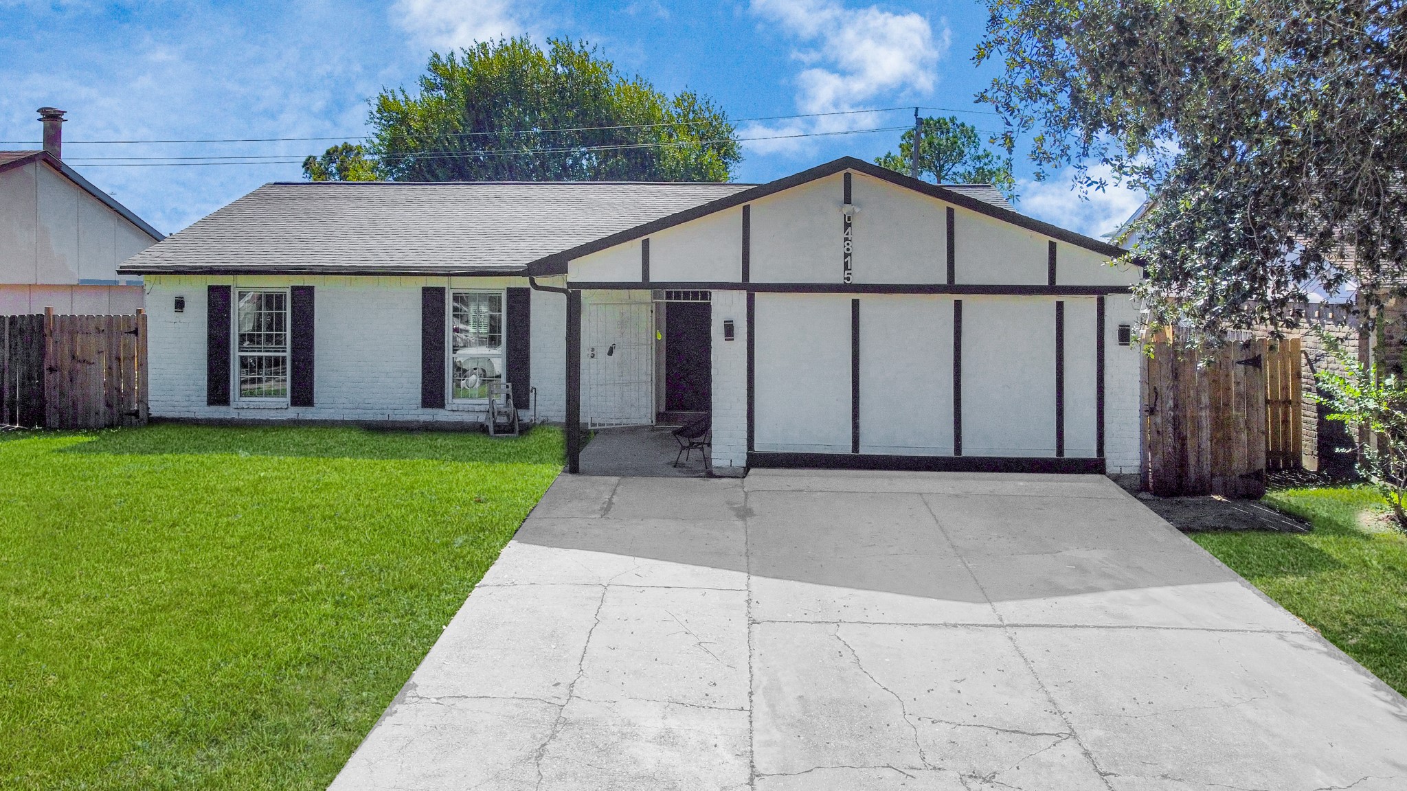 4815 Prairie Ridge Road Houston, TX 77053 - Photo 30 of 44 a view of a white house with a small yard and large tree
