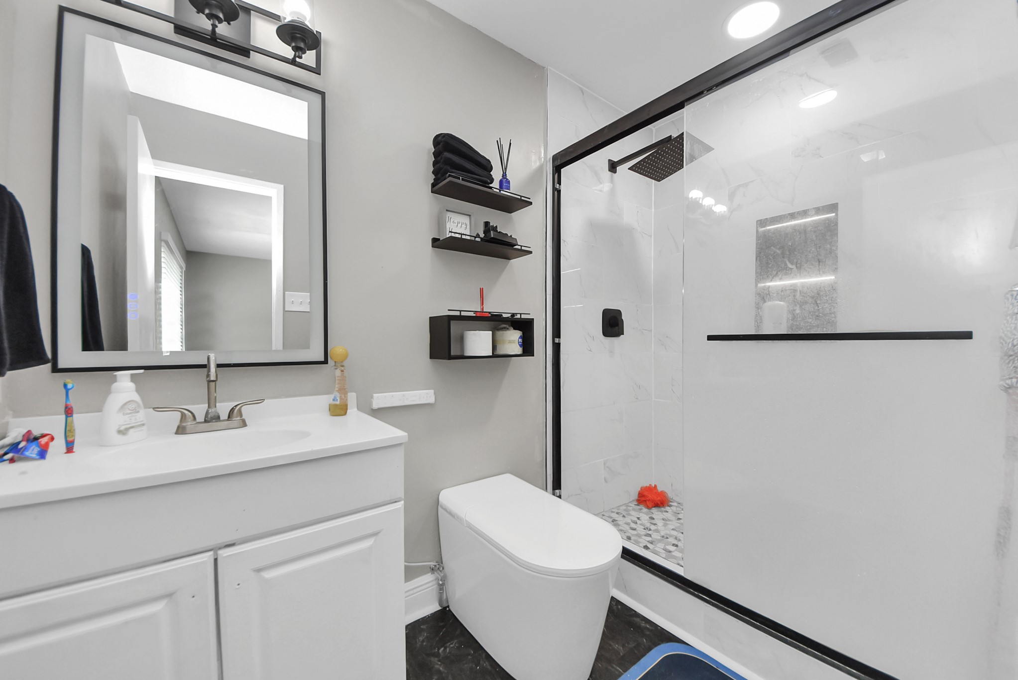 4815 Prairie Ridge Road Houston, TX 77053 - Photo 5 of 44 a bathroom with a sink vanity mirror and toilet
