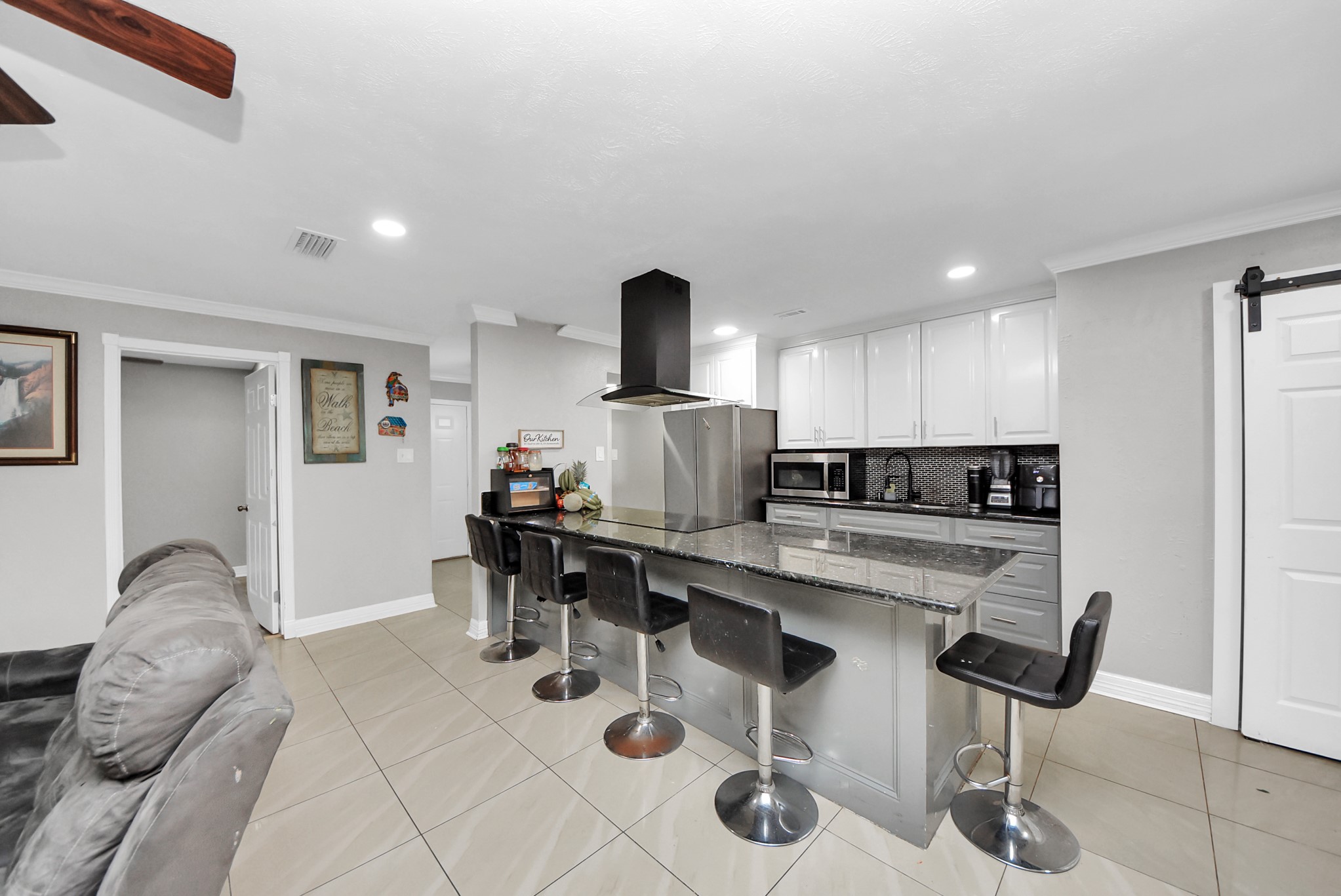 4815 Prairie Ridge Road Houston, TX 77053 - Photo 10 of 44 a kitchen with stainless steel appliances kitchen island granite countertop a sink and cabinets