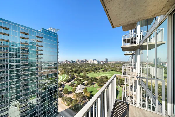 a view of a balcony with city view