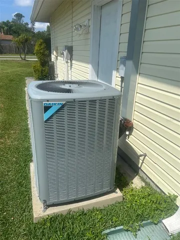 a living room with furniture a chandelier and a window