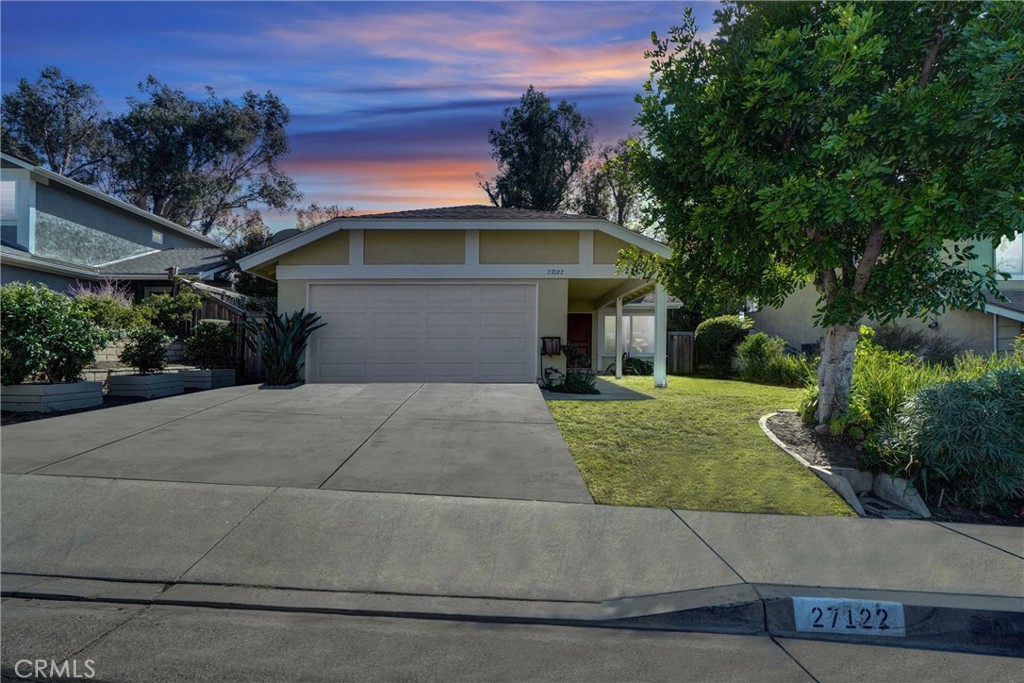 27122 Valleymont Road Lake Forest, CA 92630 - Photo 3 of 35 a front view of a house with a yard and trees