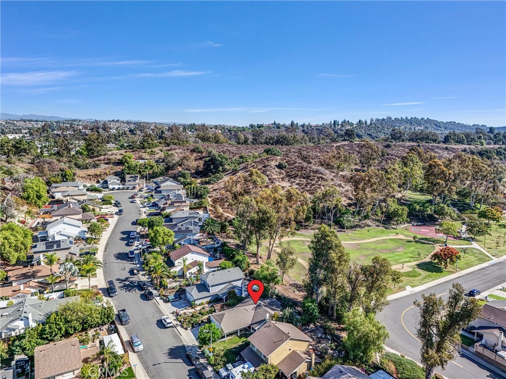 27122 Valleymont Road Lake Forest, CA 92630 - Photo 35 of 35 an aerial view of residential houses with outdoor space and trees