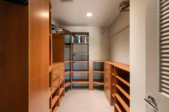 a view of an empty room with stairs