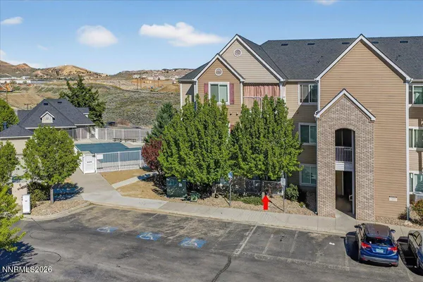 a work room with furniture and floor to ceiling windows