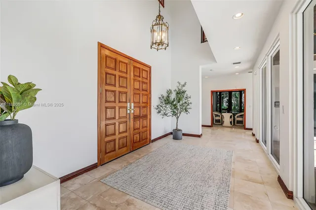 a view of an entryway with wooden floor