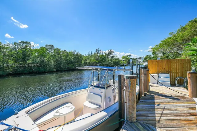 a view of a balcony with two chairs and a table