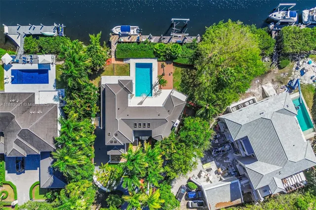 an aerial view of a house with outdoor space and street view